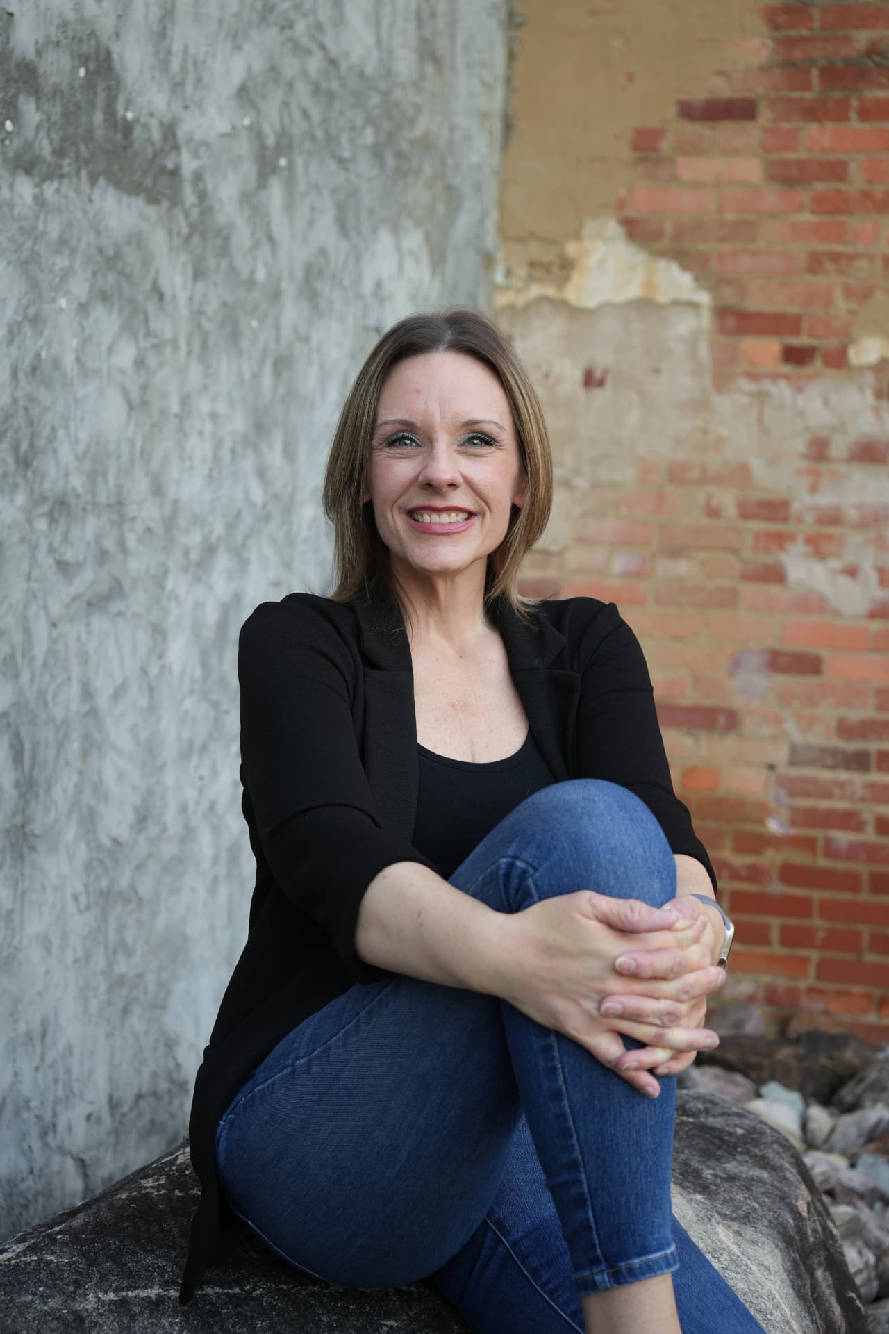 LaCrisha Lorenzoni seated, smiling